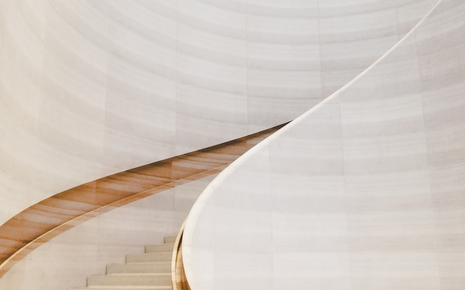 Soft beige swirling staircase detail